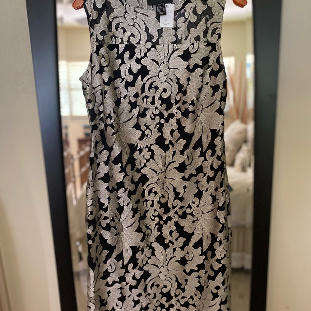 Designer Frank Lyman. New with tags holiday party dress. Lined. Knee length.